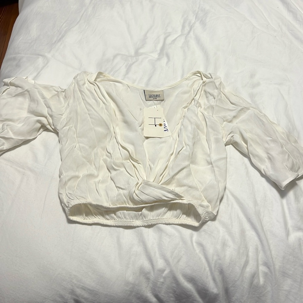 White crop top. V low neck.